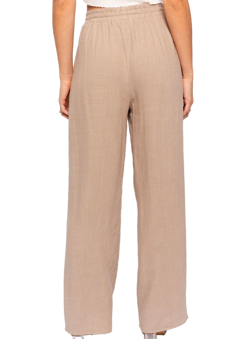 Pretty And Pleated Pants  Woven pleated pant in Taupe. Back view.
