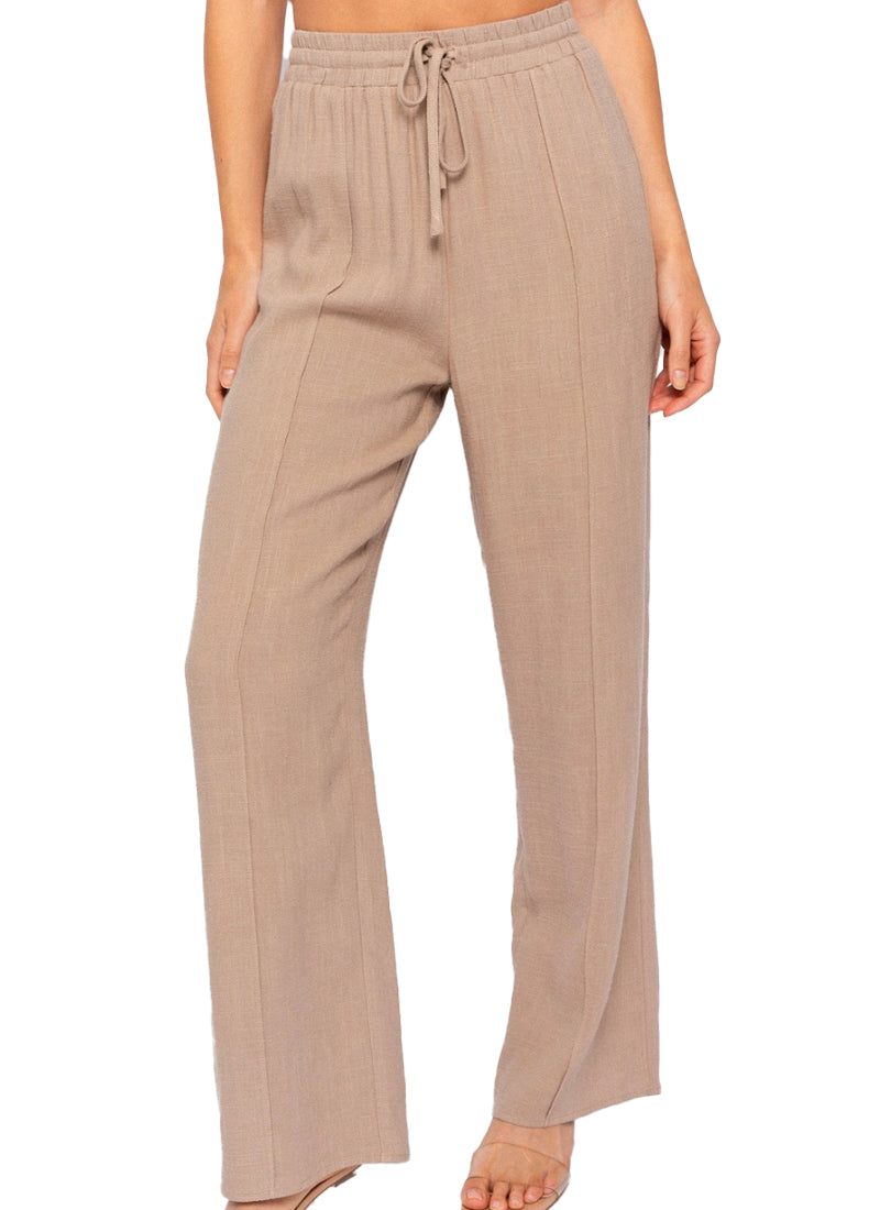 Pretty And Pleated Pants  Woven pleated pant in Taupe.