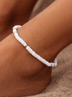 No beach day’s complete without a little sun, sand and our Puka Shell Stretch Anklet! With an easy on-and-off design, this seaside style features all-natural, raw puka shell beads, plus silver spacer beads for some eye-catching shine. on ankle. 