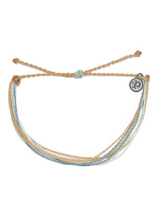Pura Vida Bright Original Bracelet in Gold Coast  It’s the bracelet that started it all. Each one is handmade, waterproof and totally unique—in fact, the more you wear it, the cooler it looks. Grab yours today to feel the Pura Vida vibes.  Brand: Pura Vida Material: Wax-Coated Size & Fit: Adjustable from 2-5 Inches in Diameter  