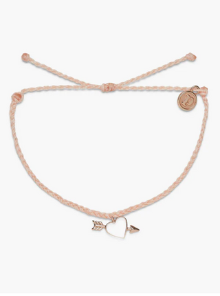 Pura Vida Lovestruck Charm Bracelet  Been daydreaming about the perfect piece to add to your stack? Our Lovestruck Charm Bracelet is it! This bitty braid design comes with an enamel heart charm pierced through with an arrow.   Brand: Pura Vida Material: 100% Waterproof, brass base with rose gold plating & enamel Size & Fit: Adjustable from 2-5 Inches in Diameter 
