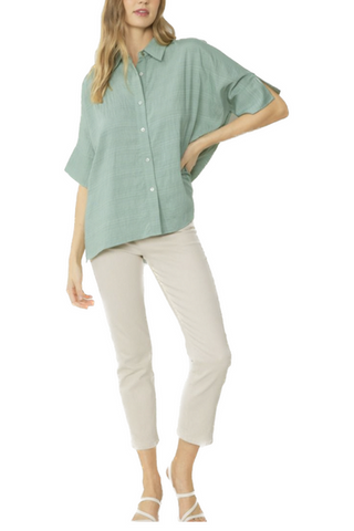 This is the perfect spring time button up collared, 1/2 sleeve top, featuring slits at sleeves. Unlined. Woven. Non-sheer. Lightweight.   80% Rayon 20% Polyester