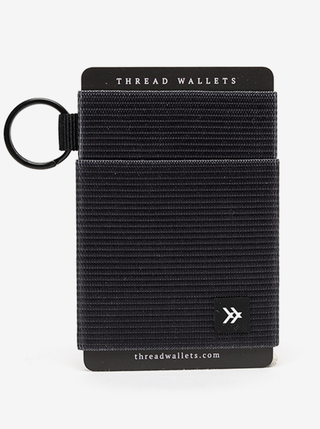 Black Elastic Wallet  Our patented Elastic Card Holder is Thread Wallets original wallet. The perfect minimal way to hold all your cards, made for all of life’s adventures.  • Holds 2-10 cards/cash  • Elastic expands/contracts to keep cards tight.  • Slim profile offers front pocket use. Attach keys, gym passes, lanyards, etc.