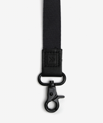 Black Neck Lanyard  Take on the world in style with our Neck Lanyard–the perfect sidekick to carry your keys, Thread® essentials, and more. Keep track of your stuff and express yourself with our convenient and cool lanyards.  • Polyester strap, genuine leather loop and metal clasp   • Quality Metal clasp Alt view