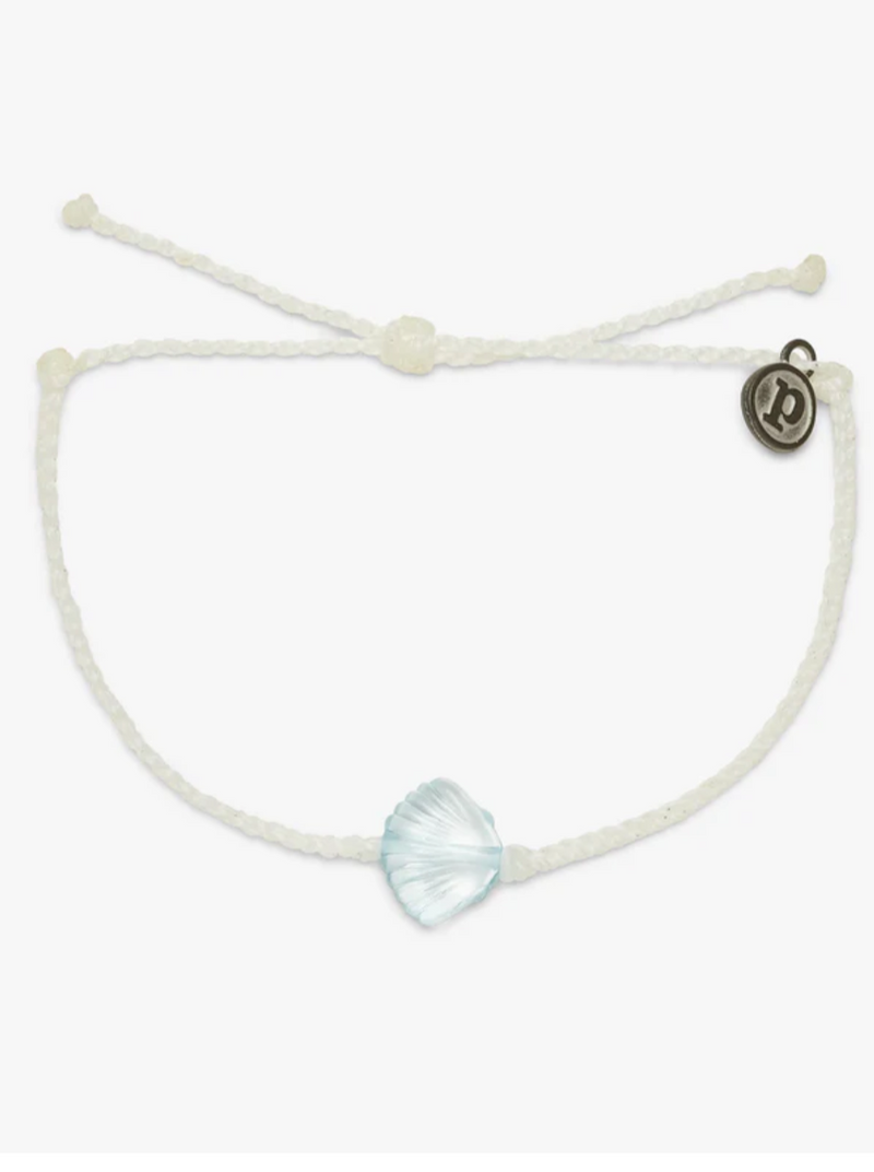 Pura Vida Sea Through You Shell Bracelet in Blue  It’s pretty clear you’ll love our Sea Through You Shell Charm Bracelet! This bitty braid style features a transparent shell charm for a look that was practically made for mermaids.  Brand: Pura Vida Material: 100% Waterproof, Shell charm: 12mm (H) x 12mm (W) Size & Fit: Adjustable from 2-5 Inches in Diameter 
