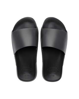 Havaianas Slide Classic Sandal in Black  The comfort of Havaianas and the ease of a slide? Yes please! Featuring a contoured footbed and available in so many different colors, you'll always be sliding around in comfort and style. Strap: 100% PVC Logo: 100% Plastisol Outsole: 100% Rubber Slide style Cushioned footbed Made in Brazil