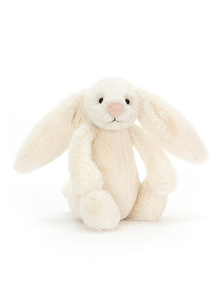 Small Bashful Bunny - Cream  Bashful Grey Bunny is a popular fellow with scrummy-soft Jellycat fur and lovely long flopsy ears mean that with just one cuddle, you’ll never want to let go. Irresistibly cute and a perfect gift for boys or girls. Everyone treasures this little beige bunny.