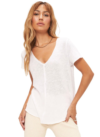 Wearever Tee in White  This tee is where it all began. The Wearever is our signature style and has become a staple in closets worldwide.   This always flattering tee has a relaxed fit, v-neckline and center seam detail. It is finished with raw edging throughout and a shirttail hemline.