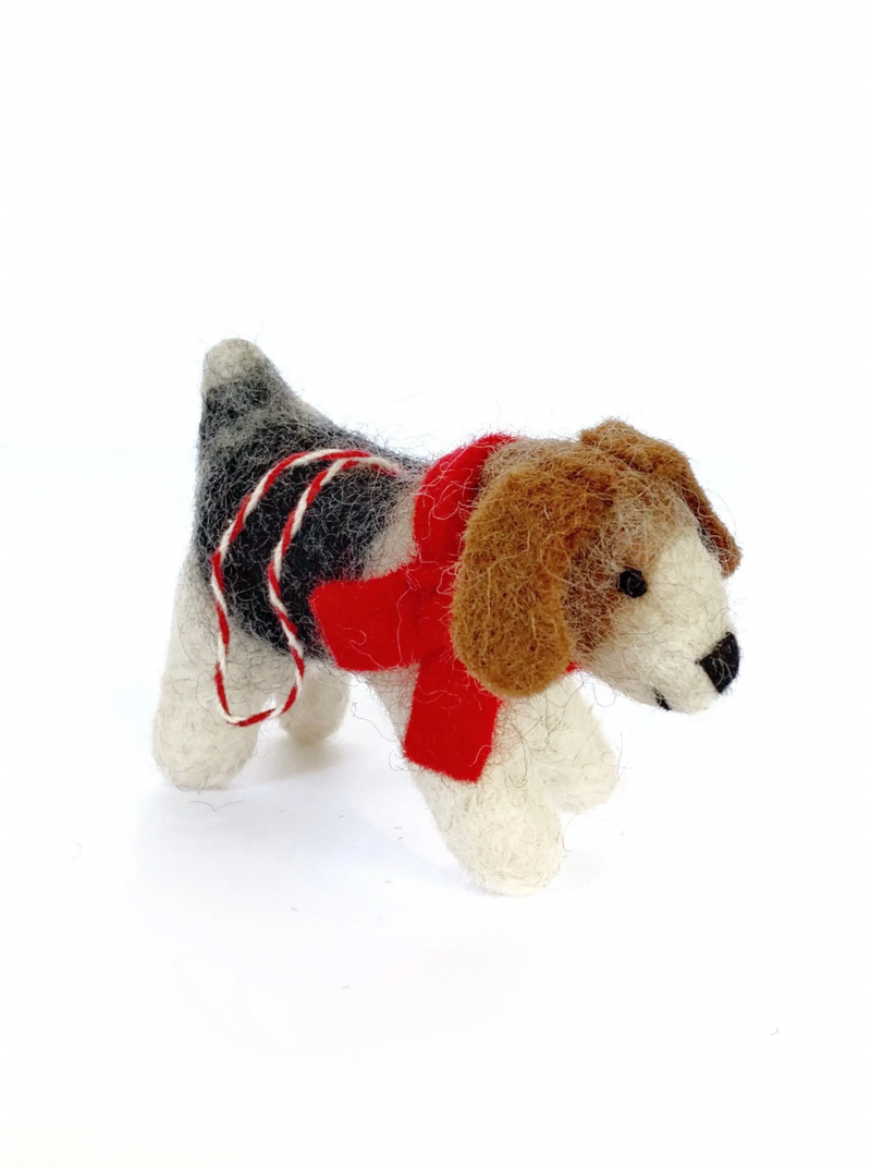 Wool Dog with Scarf Ornament  This furry friend is looking for a new home this Christmas! Our Tufted Wool Dog Ornament is handmade by artisans in Nepal, Asia using colorful sheep wool. Tufted ornaments are perfect for the toughest toddler or curious critter. This popular pup is an Ornaments 4 Orphans' best seller - adopt him today!