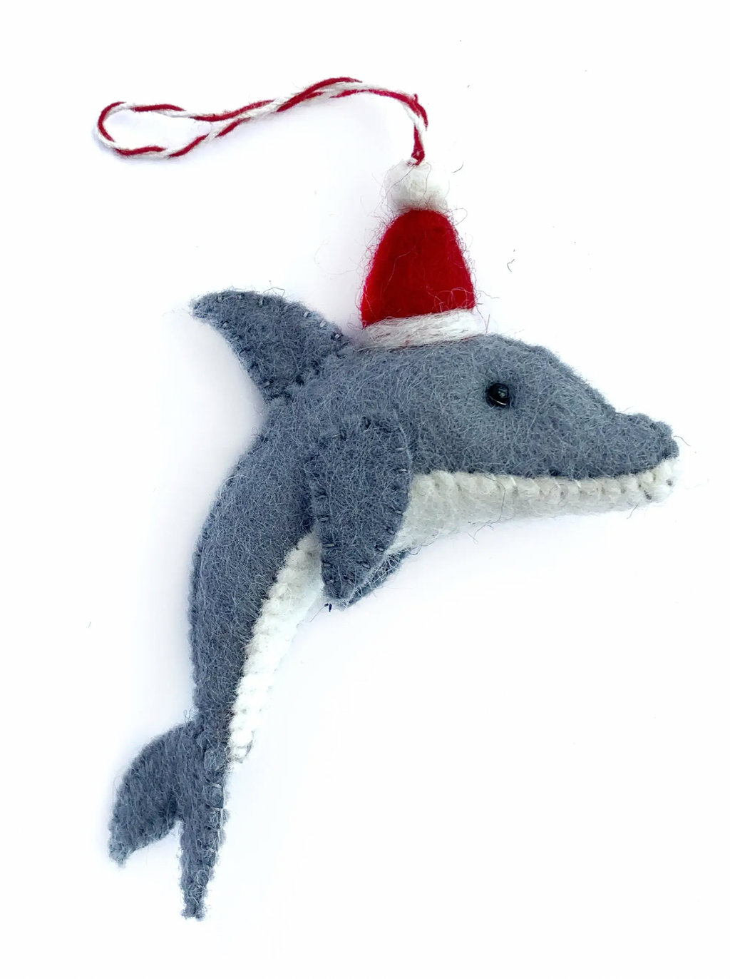 Wool Dolphin Santa Ornament  Adventure under the sea this holiday with our NEW Dolphin Ornament! This friendly fellow is decked out and ready to celebrate in a red Santa hat! Our felt wool ornaments are handmade by artisans in Nepal, Asia using colorful sheep wool. Popular for their charming and durable designs, felted ornaments are perfect for the toughest toddler or curious critter.