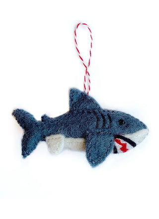 Wool Shark Ornament   Prowl the ocean this Christmas with this stealthy great white. Our felt wool shark ornament is handstitched by artisans in Nepal, Asia using colorful sheep wool. Popular for their charming and durable designs, felted ornaments are perfect for the toughest toddler or curious critter. 
